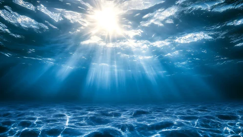 Sunlight penetrates clear ocean water in radiating beams