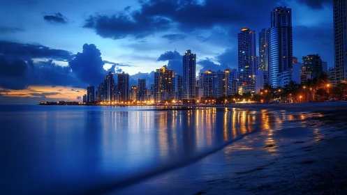 Twilight coastal skyline with glowing tower reflections at dusk.