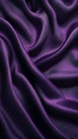Purple satin fabric with folds and directional light.