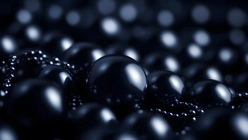 Glossy black spheres cluster in tight macro composition