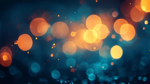Warm orange and blue bokeh lights in dreamy abstract style.
