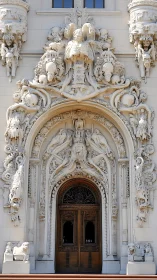 Baroque stone portal of sculpted stories and silent guardians.