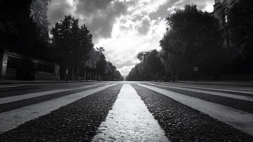 Monochrome street crosswalk extends toward distant vanishing point