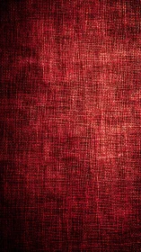 Red woven textile surface shows dramatic directional lighting