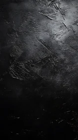 Textured black concrete backdrop with subtle metallic sheen.