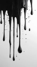 Glossy black paint drips slide down in bold liquid lines