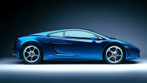 Midnight blue sports car glowing under studio lights.