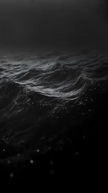 Storm-dark ocean waves shimmer against a voidlike horizon.