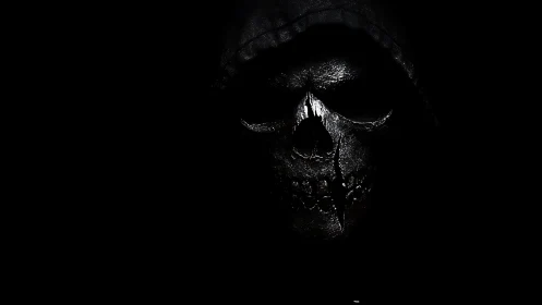 Shrouded metal skull emerging from deep black void.