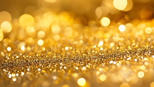 Macro golden glitter field with luminous bokeh structure.