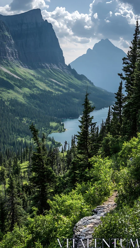 Mountain lake valley framed by alpine trail and steep cliffs