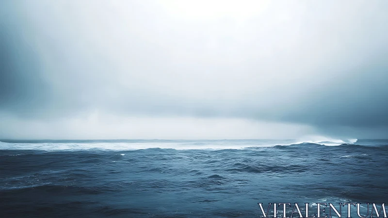 Moody open ocean under heavy mist and pale sky.