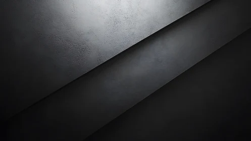 Dark diagonal concrete planes under soft directional light.