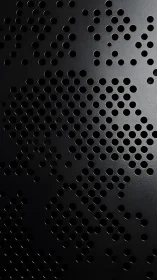 Perforated black metal surface shows dense circular hole grid
