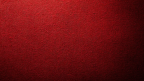 Macro woven red textile surface with diagonal basketweave pattern