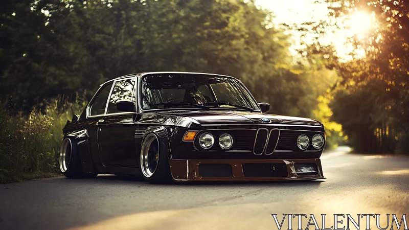 Stanced classic BMW coupe with widebody kit in sunset light