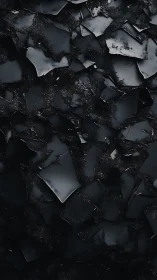 Jagged black glass shards glisten in stark abstract minimalism