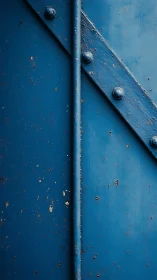 Weathered blue metal panel with bold industrial texture.
