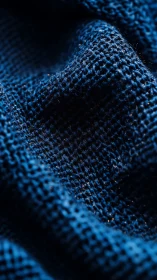 Deep Blue Textile Close-Up With Intricate Weave Pattern.