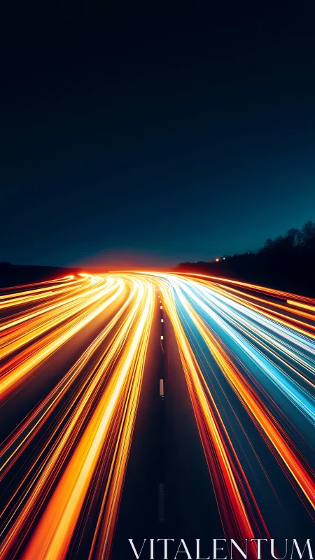 Long exposure light trails on divided highway at night.