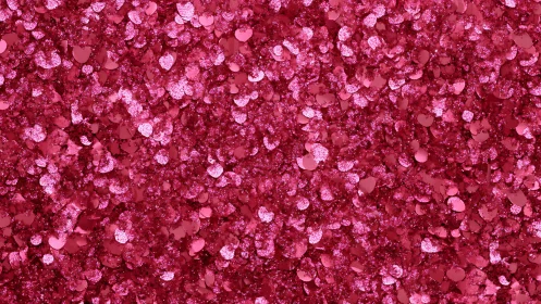 Pink heart glitter confetti background with dense sparkle.