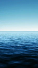 Calm blue ocean horizon under clear gradient sky.