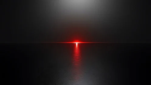 Red horizon light source reflects across dark water surface