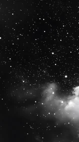 Midnight nebula drifts through a diamond pinned starfield.