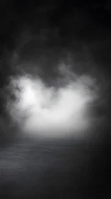 Dense white fog over dark reflective water surface.