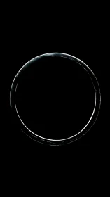 Minimal glowing circular ring on solid black background.