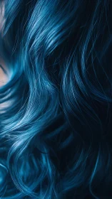 Close-up detail of flowing blue wavy hair strands.