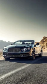 Luxury black cabriolet on sunlit desert highway. Period.