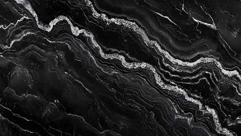 Black marble veins form flowing abstract monochrome landscape.