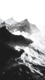 Monochrome coastal massif with fog-laden surf impact zone