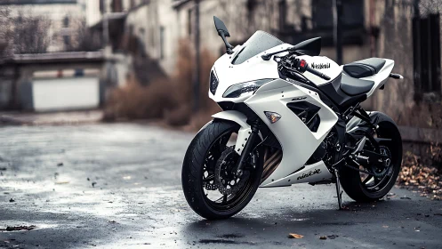 White sport motorcycle in moody urban backstreet setting.