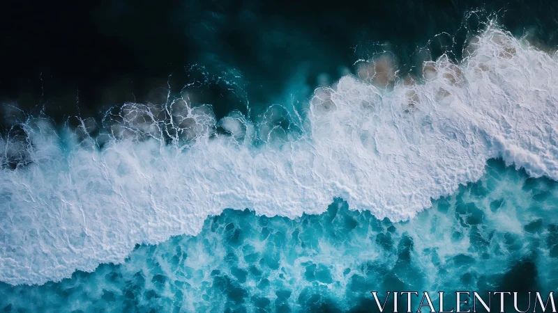 Aerial view of ocean surf forming white wave bands.