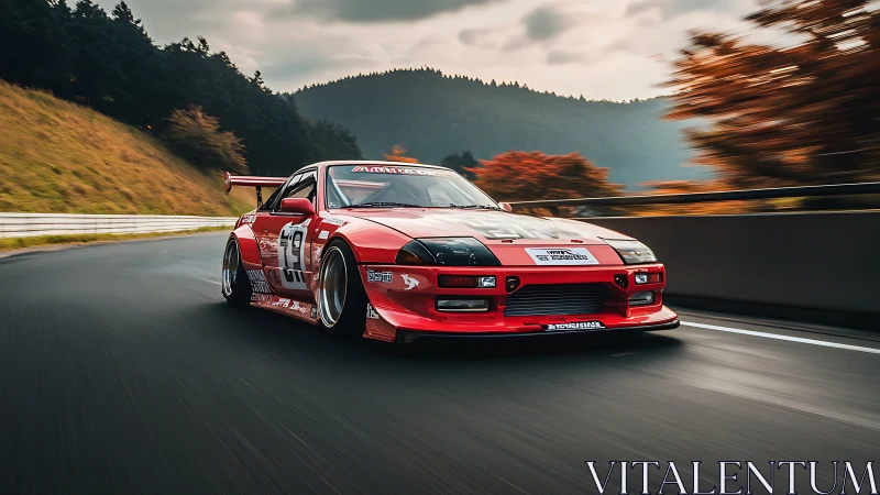 Red time-attack race car corners on autumn mountain circuit.