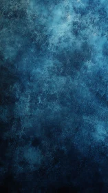 Textured blue abstract surface with dark tonal variation.