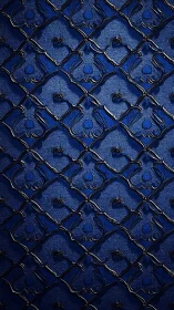 Quilted blue leather with metallic stud embellishment and geometric pattern.