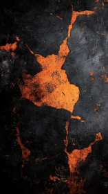 Molten orange fractures glow beneath scorched black stone
