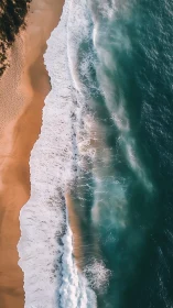 Aerial shoreline study with turquoise surf and golden sand.