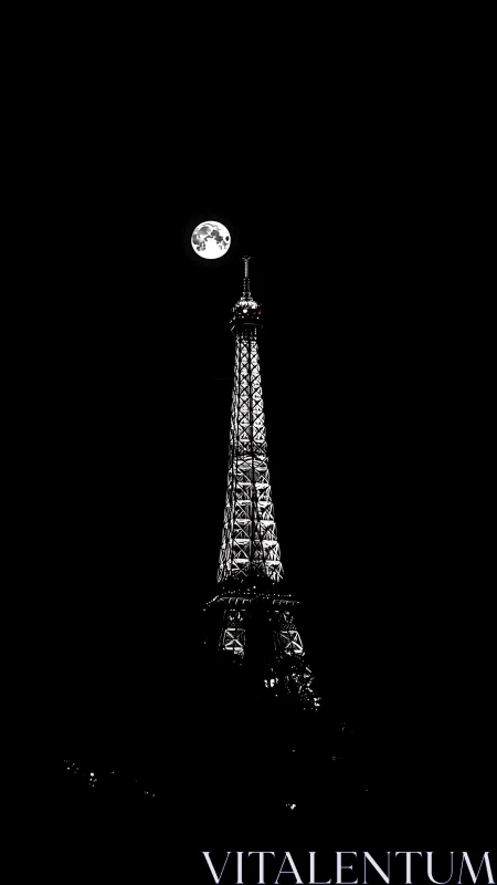 Moonlit tower pierces velvet night above silent city.