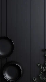 Matte black plates on vertical slatted backdrop emphasize minimalism