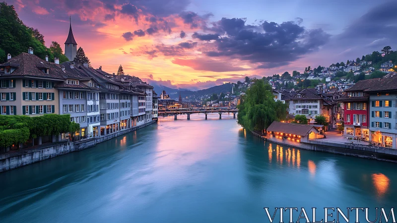 Riverside European old town under vivid sunset sky glow.