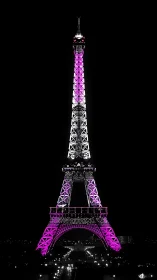 Eiffel Tower structure is illuminated with selective magenta lighting