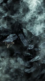 Smoldering charcoal bed with drifting pale smoke plumes.
