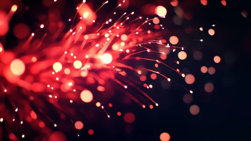 Optical fiber bokeh stream in high-intensity crimson field.
