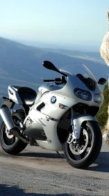 Sleek silver BMW motorcycle waits for an open mountain road