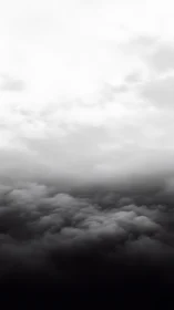 Monochrome cloud layers form a vertical gradient in frame