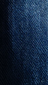 Macro denim weave captures deep indigo diagonal texture